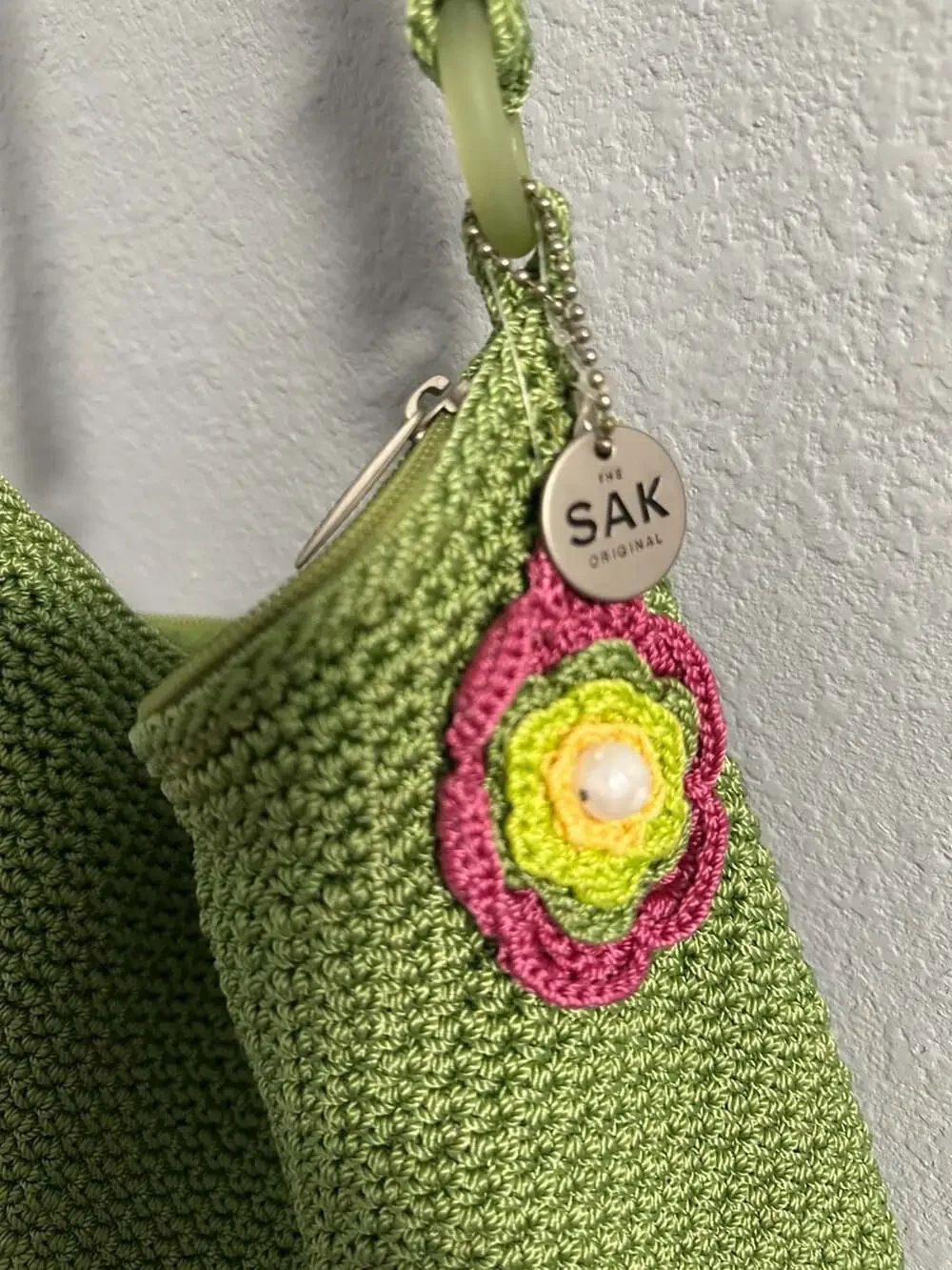 The Sak Green Crochet Shoulder Bag Hobo Purse with Flower Charm